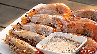 An outdoor barbecue with huge tiger prawns Stock Photo