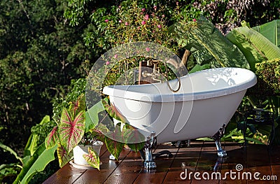 Outdoor bathtub with relaxing natural scene Stock Photo
