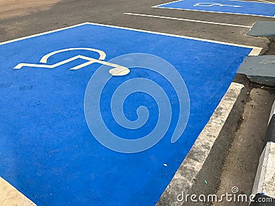 Outdoor blue Handicap parking spot Stock Photo