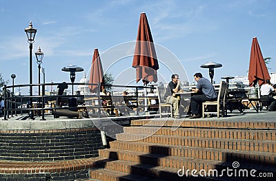 Outdoor cafe and eating area with people Editorial Stock Photo