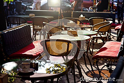 Outdoor cafe with soft seats and glass tables. Stock Photo