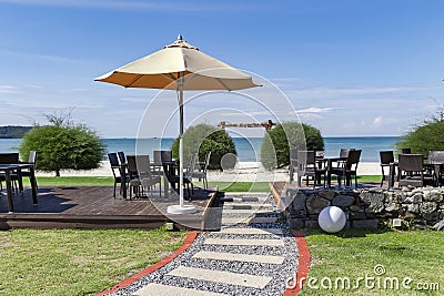 Outdoor cafe veranda with wicker furniture on Cenang beach Stock Photo