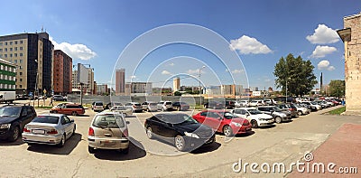 Outdoor cars parking during sunny day under the blue sky. Editorial Stock Photo
