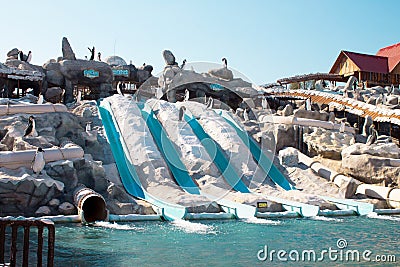 Outdoor colorful aqua park in the seaside resort, Dubai, UAE, water attractions Ice Land waterpark Stock Photo