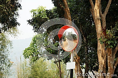 Outdoor convex mirrors. Traffic curved glass. Convex mirrors for roadside safety. Stock Photo