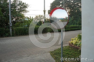 Outdoor convex mirrors. Traffic curved glass. Large convex mirror on the road to improve visibility. Convex mirrors for roadside s Stock Photo