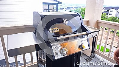 Outdoor Cooking. Grilling Dinner on Two-Burner Gas Grill Editorial Stock Photo