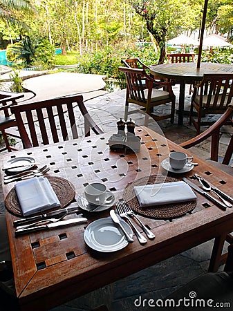 Outdoor dining restaurant, table cutlery settings Stock Photo