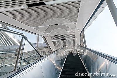 Outdoor elevators and city buildings, with sunlight in front Stock Photo