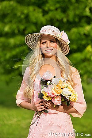 Outdoor Fashion Model Portrait, Young Woman Summer Hat Flowers Stock Photo
