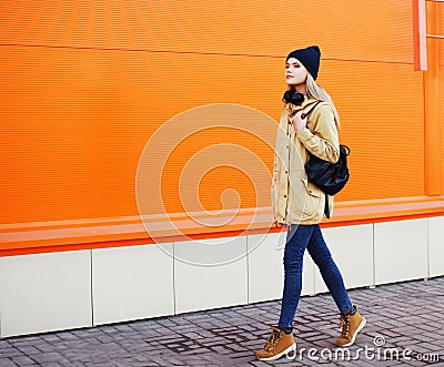 Outdoor fashion photo of stylish hipster cool girl walking Stock Photo