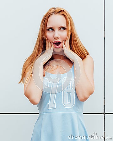 Outdoor fashion portrait of stylish young woman having fun, emotional face , laughing. Urban city street style. Spring or fall out Stock Photo