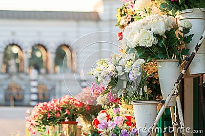 Outdoor flower market with roses, peonies and lilies. Fresh flowers street shop in historic downtown. Milan Stock Photo