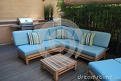 Outdoor furniture on wooden deck Stock Photo