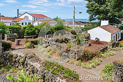 Outdoor garden with handcrafted stone objects from old wine presses, Terceira - Azores PORTUGAL Stock Photo