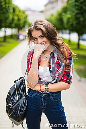 Outdoor lifestyle portrait of amazing glamorous luxury woman posing in city center Stock Photo