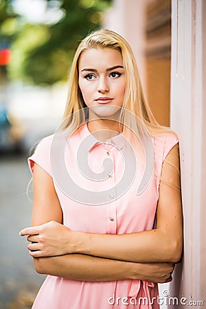 Outdoor lifestyle portrait of amazing glamorous luxury woman posing in city street. Stock Photo