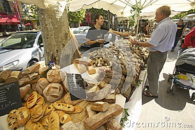 Outdoor market, bread seller in Aix en Provence, France Editorial Stock Photo