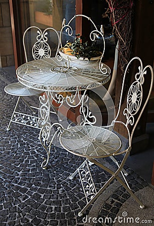 Outdoor metal table and two chairs Stock Photo