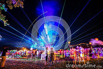 Outdoor night music party with laser lights and fire Editorial Stock Photo