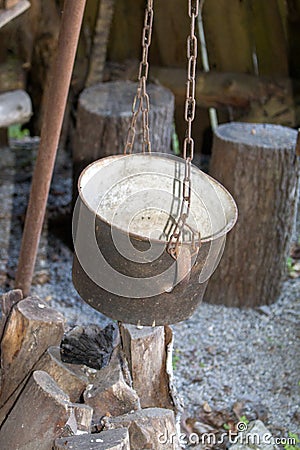 Outdoor of old medieval cauldron for cooking Stock Photo