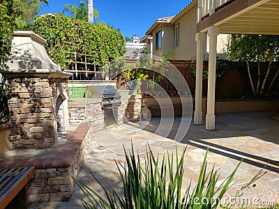 Outdoor Patio with Fireplace and Built in Grill Stock Photo
