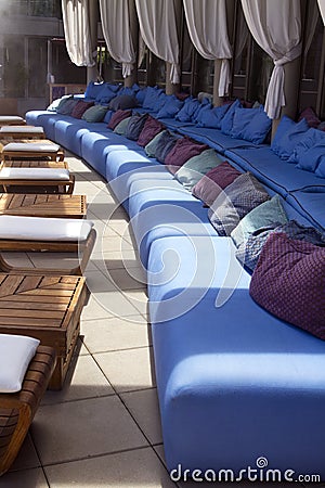 Outdoor pool patio lounge area seating Stock Photo