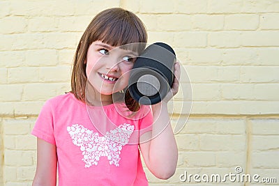 Outdoor portrait of a child listening to music. Life style Stock Photo
