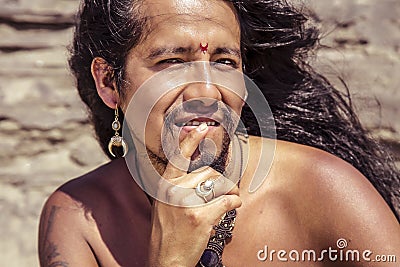 Outdoor portrait of fashionable long hair young man Stock Photo