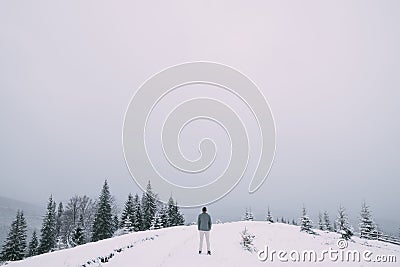 Outdoor portrait of handsome man in coat and scurf. Stock Photo