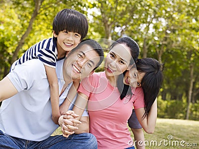 Outdoor portrait of happy asian family Stock Photo