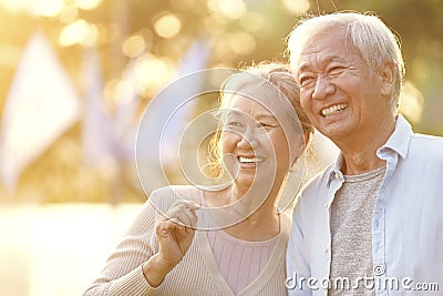 Outdoor portrait of happy senior asian couple Stock Photo