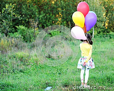 Outdoor portrait of little girl with balloons Stock Photo