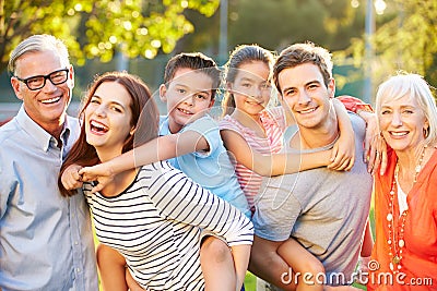 Outdoor Portrait Of Multi-Generation Family In Park Stock Photo