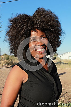 SMILING AFRICAN WOMAN Stock Photo