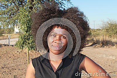 SMILING AFRICAN WOMAN Stock Photo