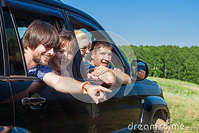 Outdoor portrait of young people looking out the window black car Stock Photo