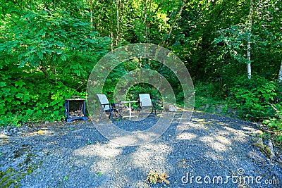 Outdoor rest area with chair and table Stock Photo