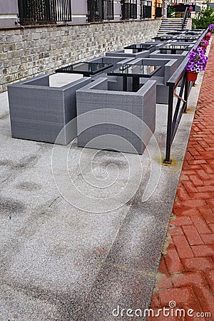 Outdoor Restaurant Summer Veranda With Wicker Furniture And Glass Tables Stock Photo