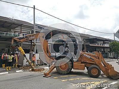 Outdoor scene of workers digging and piling concrete pole preparation for 5G cable connection Editorial Stock Photo