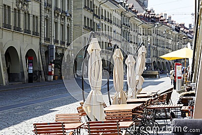 Outdoor seating restaurant on a sidewalk Editorial Stock Photo