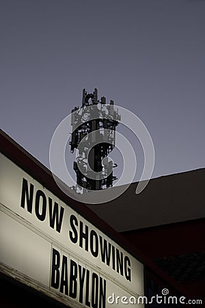 Outdoor sign for a radio tower, featuring the words "Now Showing Babylon" in bold typeface Editorial Stock Photo