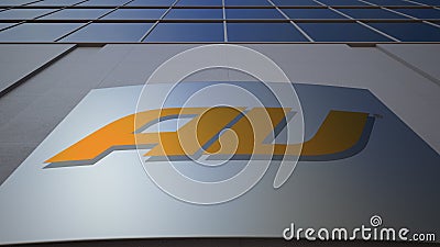 Outdoor signage board with au mobile phone company logo. Modern office building. Editorial 3D rendering Editorial Stock Photo