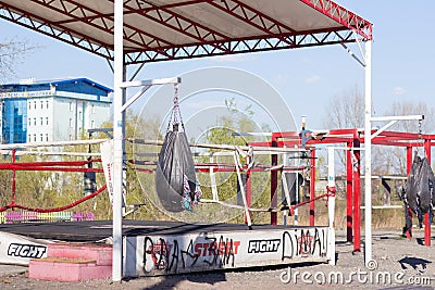 Outdoor sports ground with a punching bag and horizontal bars Editorial Stock Photo