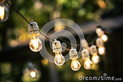 Outdoor string lights hanging on a line Stock Photo