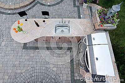 Outdoor summer kitchen with barbecue and sink Stock Photo