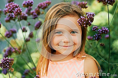 Outdoor summer portrait of adorable little girl of 3 or 4 years old Stock Photo