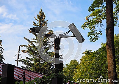 Outdoor surveillance camera installed on the gate of the courtyard in front of the house Stock Photo