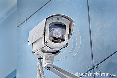 Outdoor surveillance camera on the wall Stock Photo