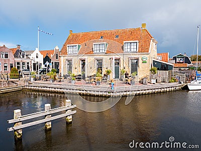 Outdoor terrace of cafe and canal in old town of Workum in Friesland, Netherlands Editorial Stock Photo